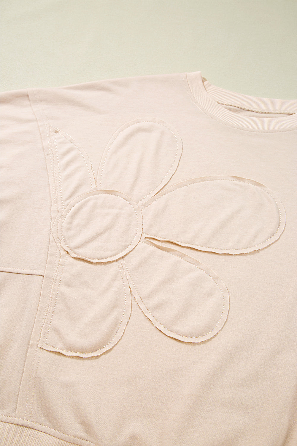 PREORDER: Beige Raw Edge Flower Patch Drop Shoulder Casual Top (Ships 3-4 Weeks)